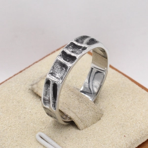 Vintage industrial style men's titanium steel ring with textured rectangular patterns
