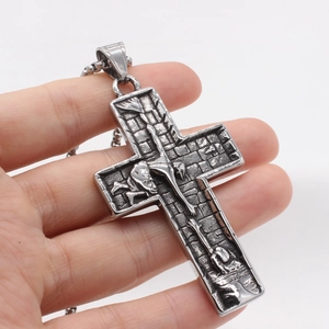 Retro stainless steel crucifix pendant necklace with detailed Jesus relief on brick texture