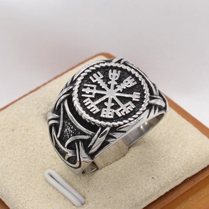 Close-up of vintage Viking Vegvisir compass ring with Celtic knot relief details
