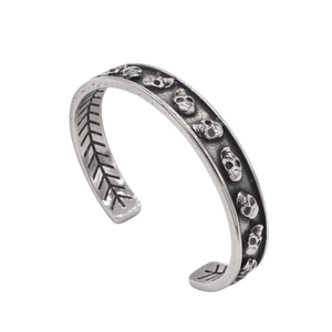 Vintage gothic men's stainless steel open cuff bracelet with carved skulls and skeletons