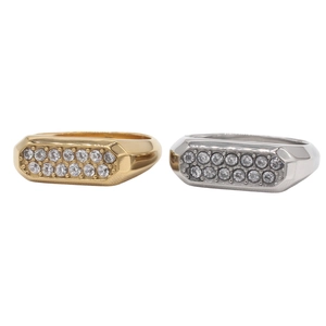 Gold and silver masculine signet rings with pave set rhinestones on a white background