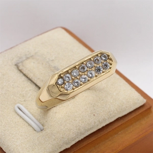 Detailed macro view of gold titanium ring featuring double row paved zirconia crystals