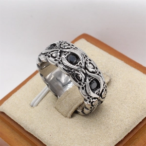 Vintage stainless steel wide ring with intricate carvings and black zircon insets