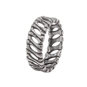 Detailed close-up of retro silver skull bone ring with vintage punk hollow texture