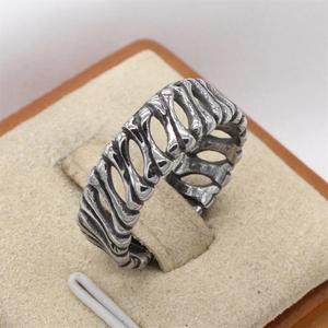 Retro punk style stainless steel skull bone ring with vintage black oxidation finish