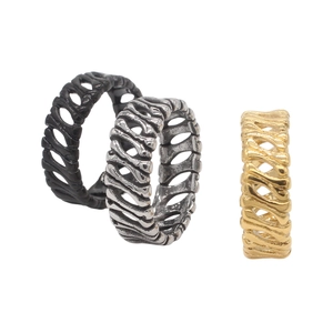 Three-piece punk skeleton ring set in matte black, antique silver, and gold steel