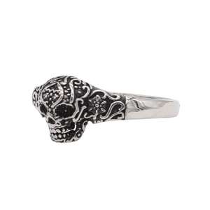 Vintage sugar skull steel ring with intricate floral carvings and polished finish