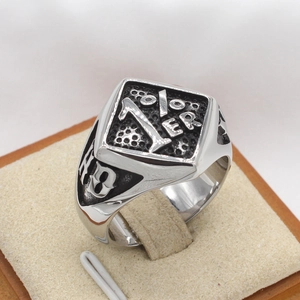 Macro view of vintage stainless steel biker ring with 1%er and 13 engravings