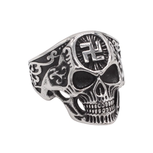 Macro detail of gothic skull ring in vintage steel finish with ornate side engravings