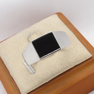 Minimalist silver stainless steel signet ring with a polished black enamel rectangle face