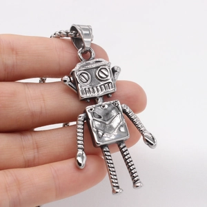 Vintage silver robot pendant necklace in stainless steel held in hand for size display