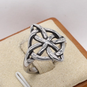 Vintage Celtic Knot titanium steel ring in silver finish displayed on beige velvet box