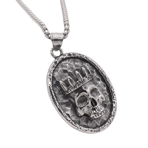 Gothic crown skull pendant necklace in vintage silver steel with hammer-textured oval base