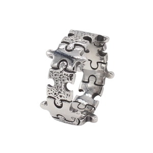 Vintage silver puzzle piece ring for men in polished and textured stainless steel