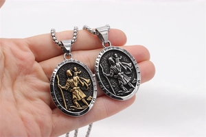 Detail of Saint Christopher oval pendants in silver and two-tone vintage stainless steel