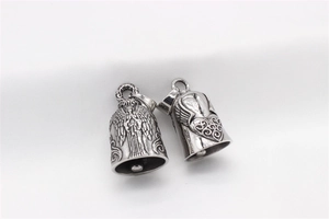 Detailed relief of guardian angel and winged heart on vintage silver bell pendants