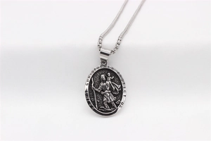 Detail of Saint Christopher round medallion pendant necklace in silver stainless steel