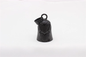 Detailed view of a black metal bell pendant featuring an embossed heart and wing design