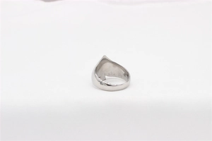 Top view of a vintage stainless steel ring with unique spade geometric outline details