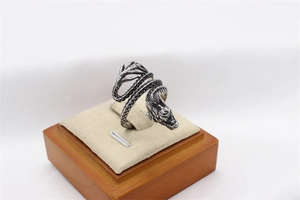 Macro detail of retro dragon ring with intricate scales and antique silver finish