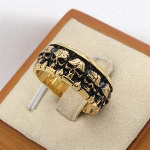 Retro gold skull ring for men with embossed gothic patterns and vintage finish