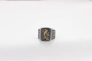 Detail of vintage silver titanium ring featuring a golden carp relief and MOHMAN engraving