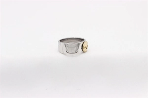 Detail view of vintage steel ring featuring a gold skull relief in punk style