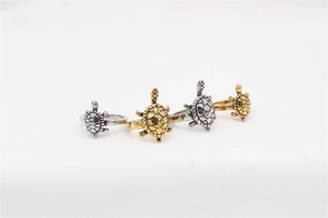 Detailed relief of vintage sea turtle rings in gold and silver stainless steel sets