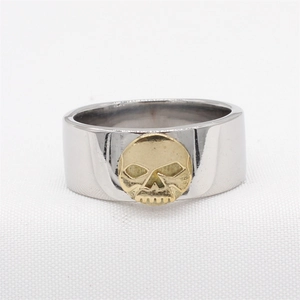 Vintage punk silver steel ring featuring a centered gold skull relief for men