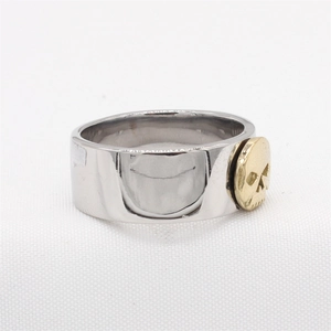 Punk style stainless steel wide band ring with a gold skull relief on silver metal