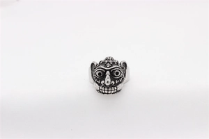 Detailed view of punk monster skull relief on vintage titanium steel ring for men