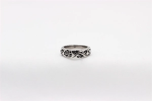 Detailed view of vintage rose pattern engraving on a men's stainless steel ring