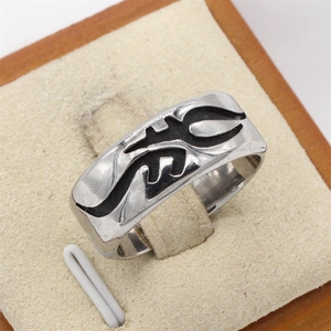 Retro gothic tribal totem wide band stainless steel ring for men on a 45-degree angle view