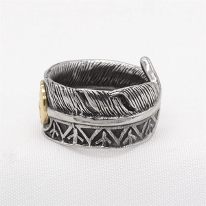 Retro stainless steel feather ring with gold accent in vintage silver finish