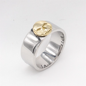 Retro punk style stainless steel skull ring with two-tone silver and gold finish