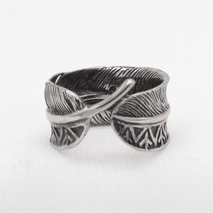 Vintage oxidized steel feather ring with adjustable band and tribal geometric carvings