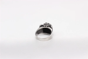 Macro side view of vintage men's stainless steel ring with black resin inlay