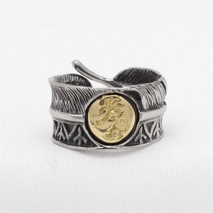 Vintage feather-textured titanium steel ring with golden Kokopelli deity inlay