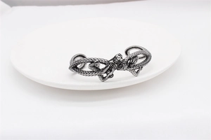 Detail of vintage dragon cuff bracelet showing oxidized scales and silver texture