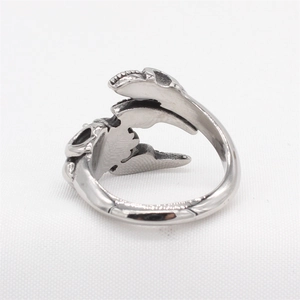 Gothic silver skull ring in stainless steel with detailed carvings on white fabric