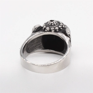 Retro gothic skull ring for men in silver steel featuring detailed embossed vintage patterns