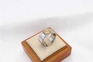 Macro view of Freemasonry All-seeing Eye emblem on polished vintage titanium ring