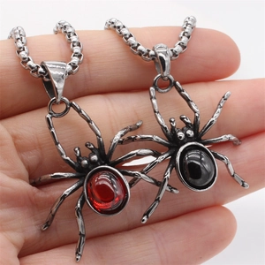 Retro spider pendant necklace set with red and black stones on a steel chain