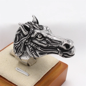 Vintage silver stainless steel ring featuring a detailed horse head carving with antique finish