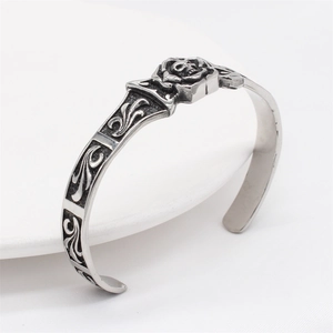 Vintage gothic men's stainless steel open bangle with skull and rose relief detail