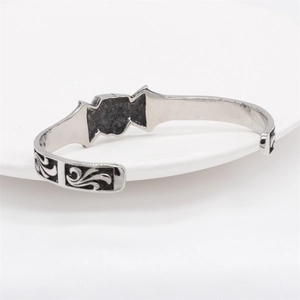 Retro stainless steel skull bracelet with black enamel vine patterns in silver finish