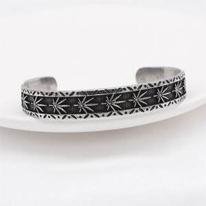 Retro punk style stainless steel open cuff bracelet featuring carved maple leaf pattern