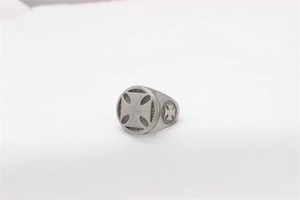 Close-up of vintage titanium steel signet ring with embossed Iron Cross design