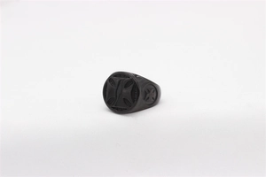 Detailed view of matte black stainless steel ring with gothic cross engravings