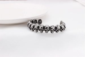 Detailed view of vintage silver skull bangle with gothic relief craftsmanship